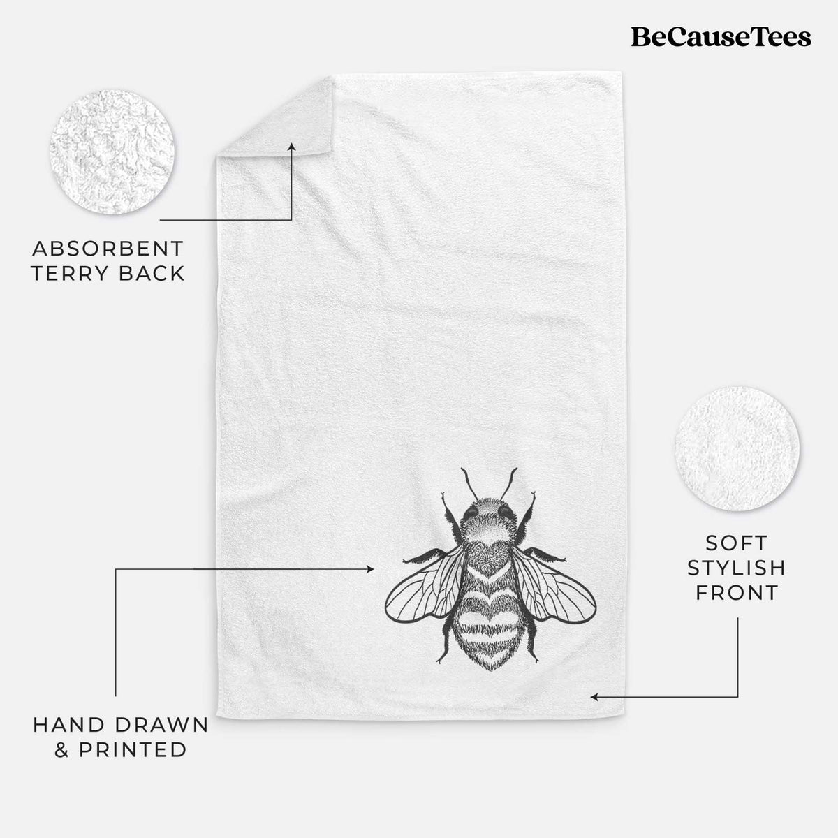 White hand towel printed with a black ink bee with a heart pattern on its body.