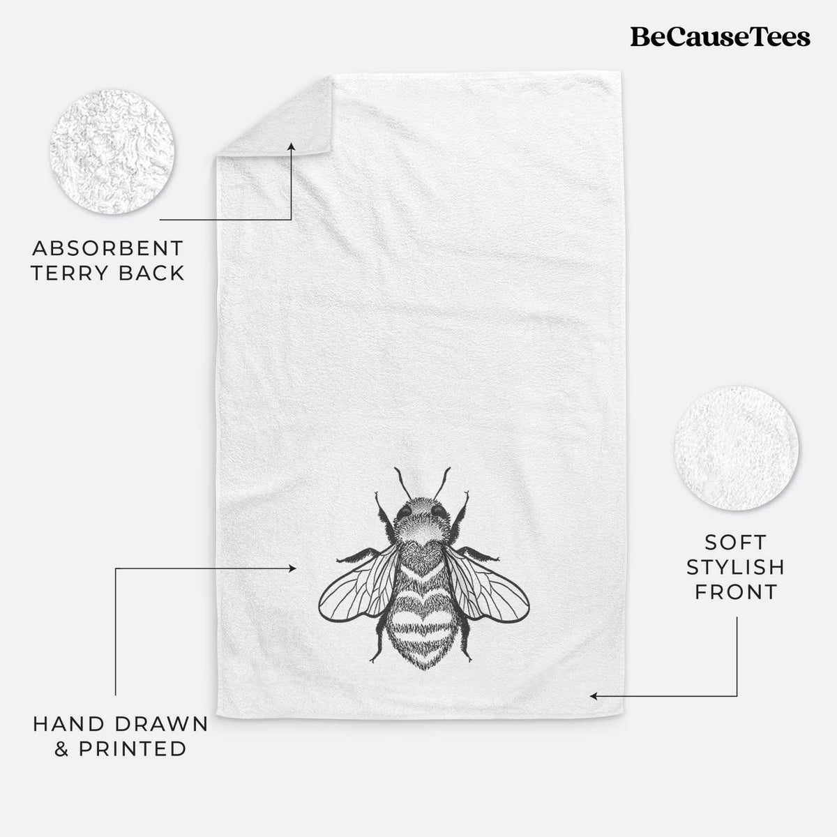 White hand towel printed with a black ink bee with a heart pattern on its body.