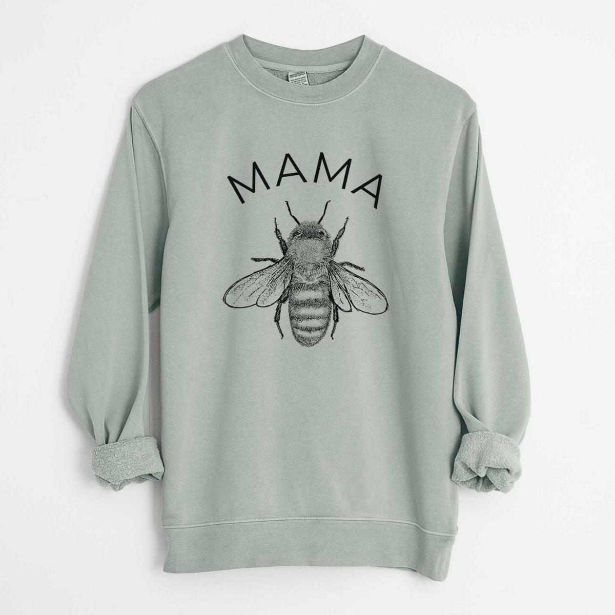 Sage green pigment dyed crewneck sweatshirt laid flat with the sleeves rolled, printed with a black ink honey bee beneath the word Mama.