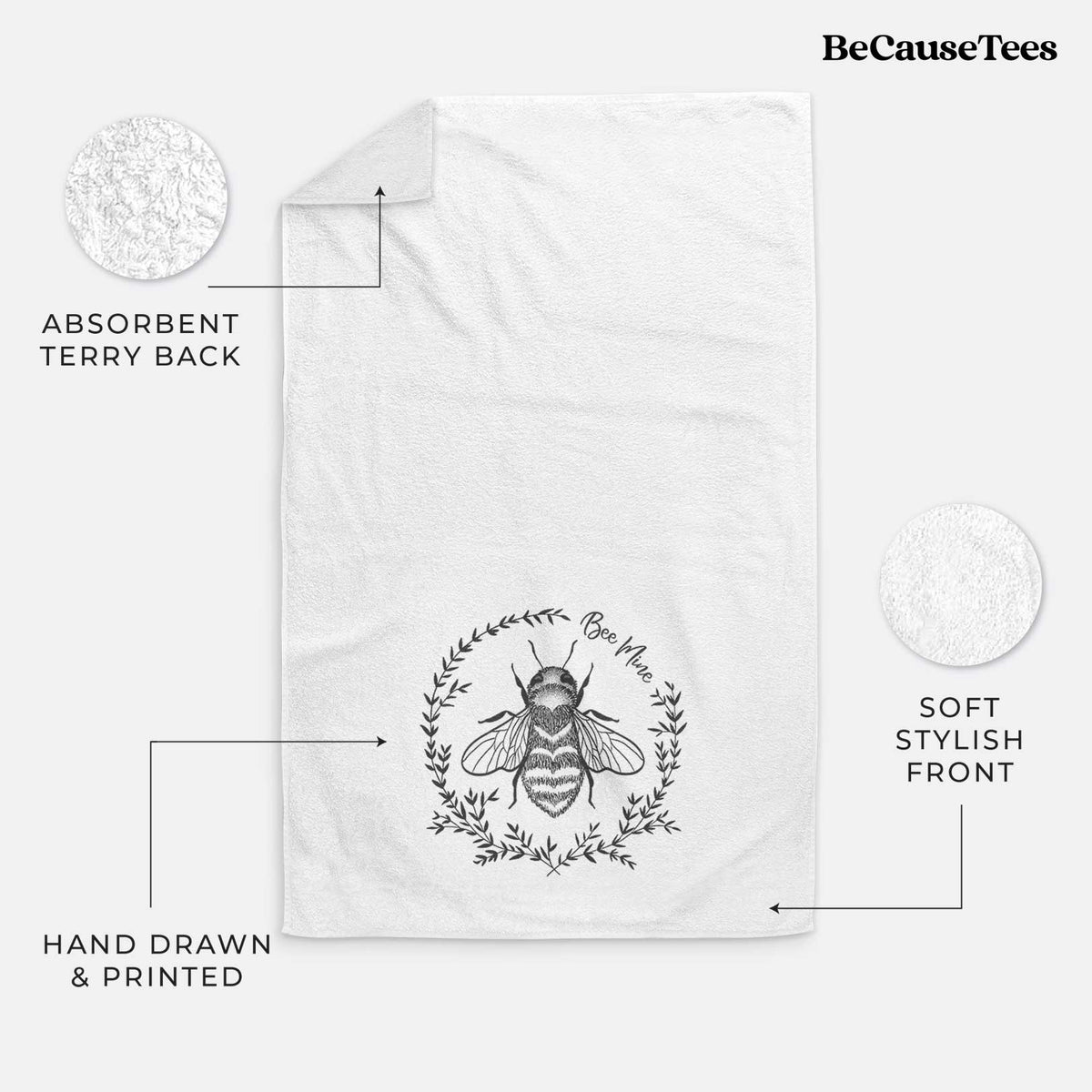 White hand towel printed with a black ink bee inside a wreath of leaves with the words Bee Mine.