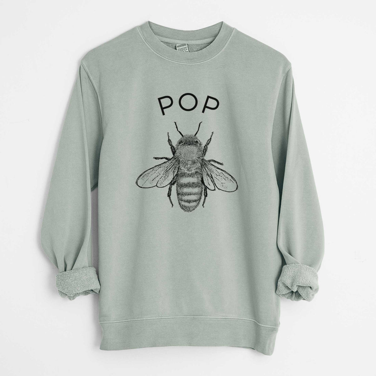 Sage green pigment dyed crewneck sweatshirt laid flat with the sleeves rolled, printed with a black ink honey bee beneath the word Pop.