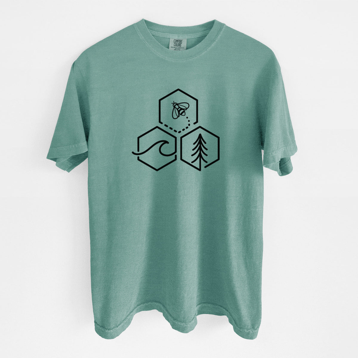 Reef green Comfort Colors t-shirt laid flat, printed with a black line art design of three hexagons holding a bee, an ocean wave and a pine tree.