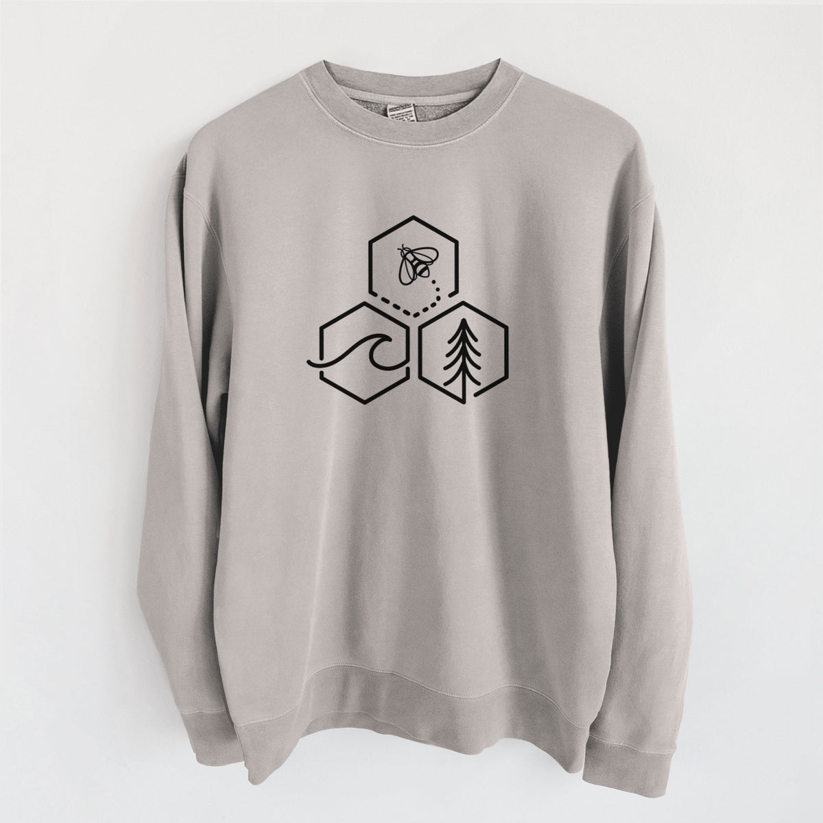 Cement grey pigment dyed crewneck sweatshirt laid flat, printed with a black line art design of three hexagons holding a bee, an ocean wave and a pine tree.