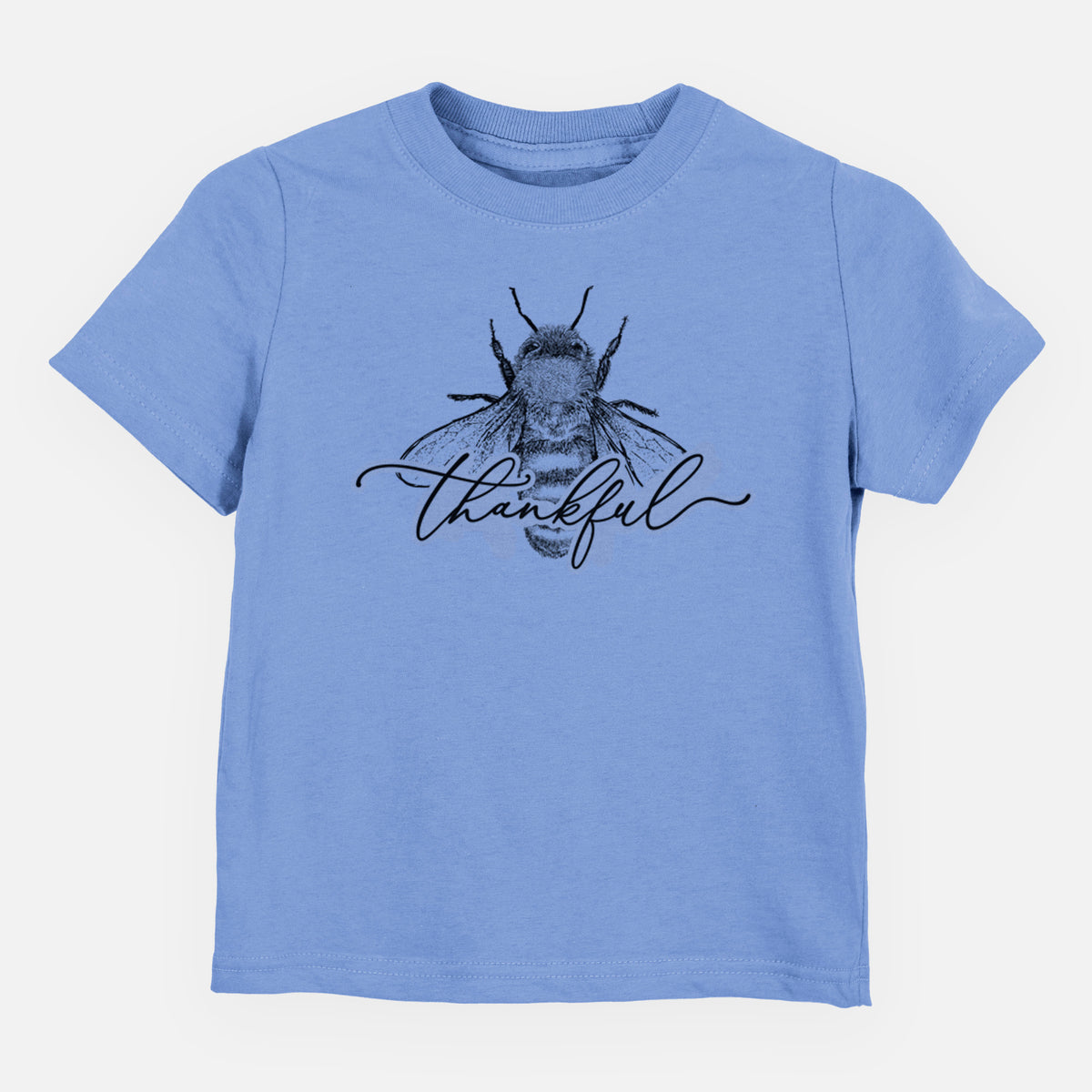 Carolina blue toddler t-shirt laid flat, printed with a black ink bee with the word thankful written in script across it.