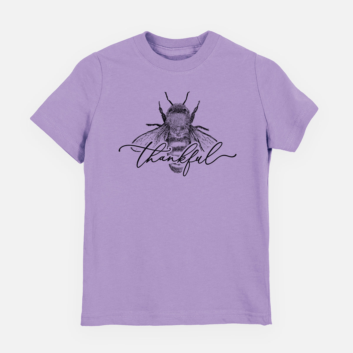Lavender youth t-shirt laid flat, printed with a black ink bee with the word thankful written in script across it.