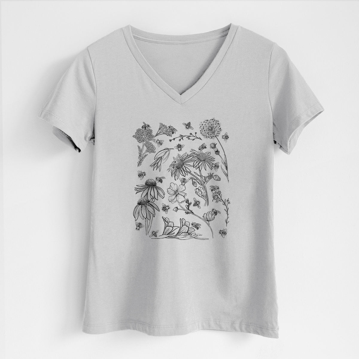 Lunar grey women's relaxed fit cotton V-neck t-shirt laid flat, printed with black ink bees scattered among wildflowers.