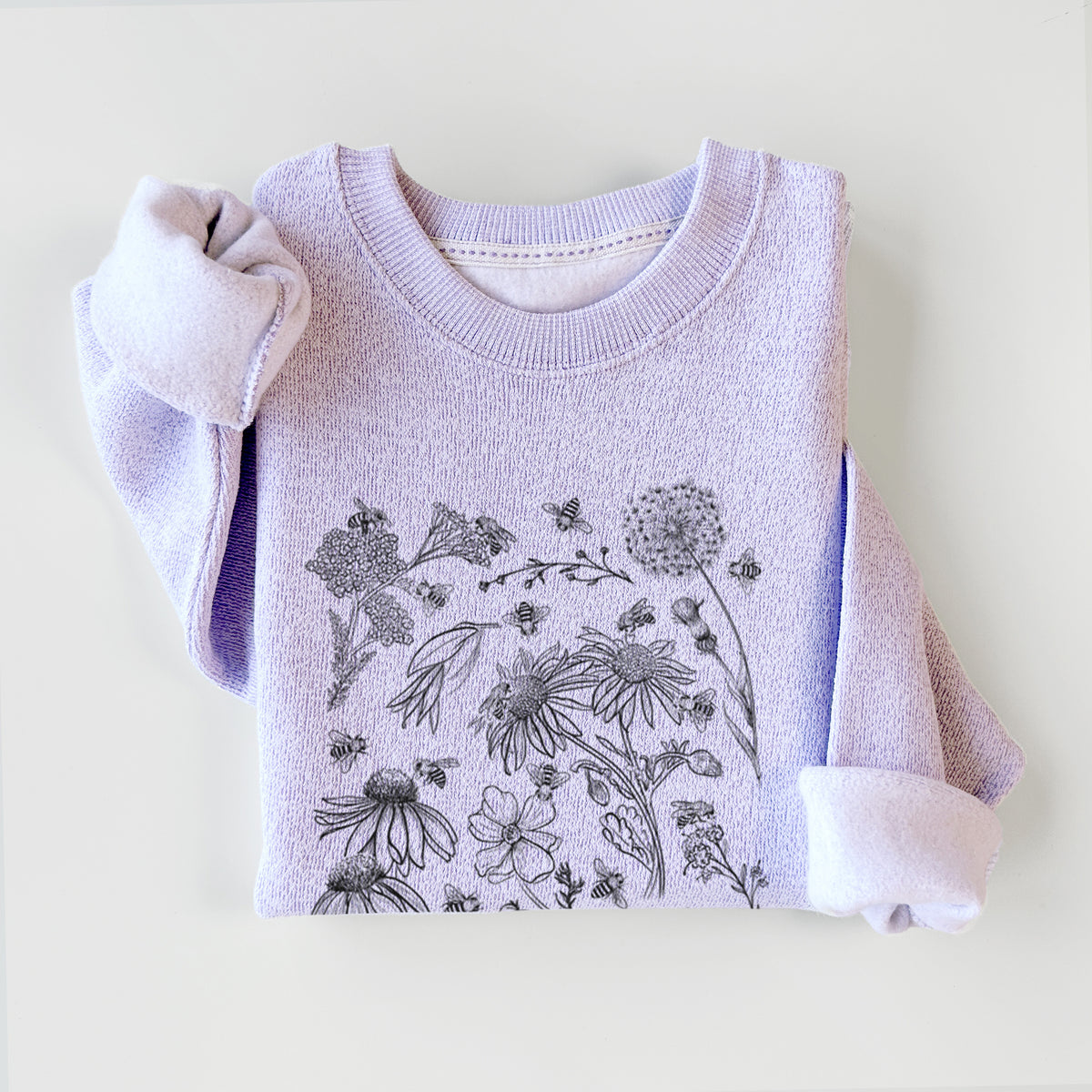 Ice purple knit sweatshirt printed with black ink bees scattered among wildflowers, styled flat.