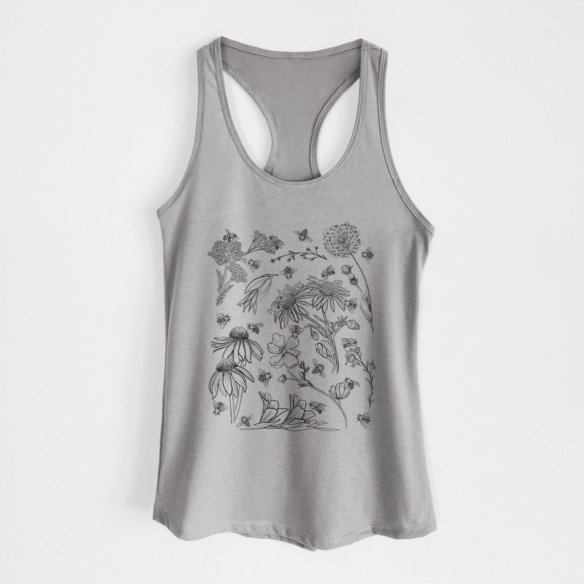 Heather grey women's racerback tank top laid flat, printed with black ink bees scattered among wildflowers.