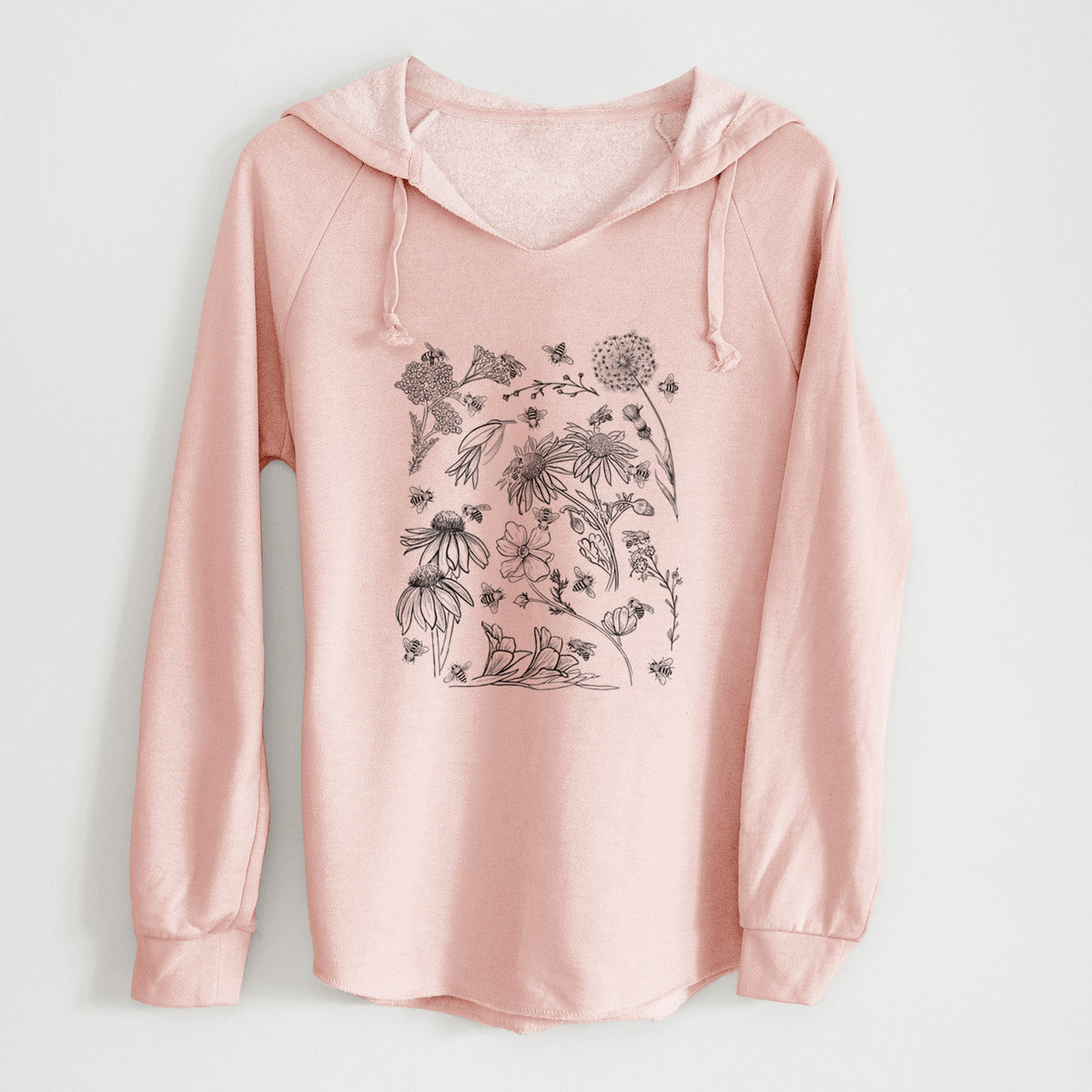 Blush pink women's Cali Wave hooded sweatshirt laid flat, printed with black ink bees scattered among wildflowers.