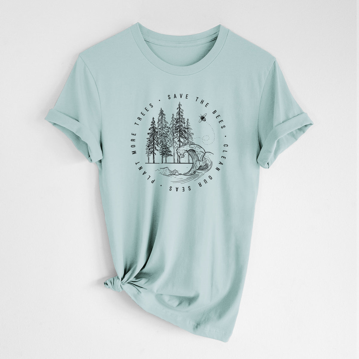 Dusty blue lightweight cotton t-shirt laid flat with the sleeves rolled, printed with a circle of pine trees and an ocean wave ringed by the words Save the Bees, Clean Our Seas, Plant More Trees.