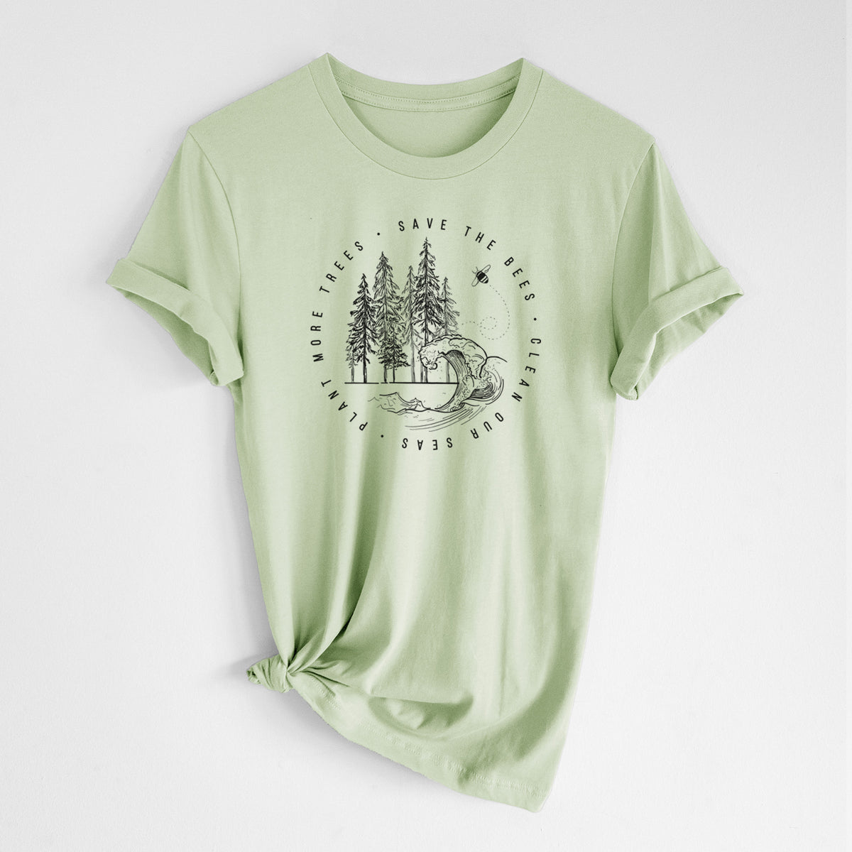 Spring green lightweight cotton t-shirt laid flat with the sleeves rolled, printed with a circle of pine trees and an ocean wave ringed by the words Save the Bees, Clean Our Seas, Plant More Trees.
