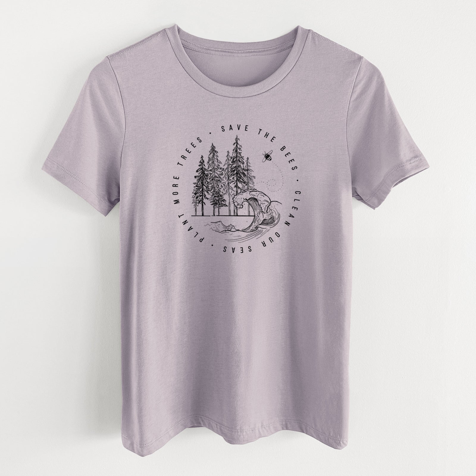 Light violet women's relaxed fit cotton t-shirt laid flat, printed with a circle of pine trees and an ocean wave ringed by the words Save the Bees, Clean Our Seas, Plant More Trees.