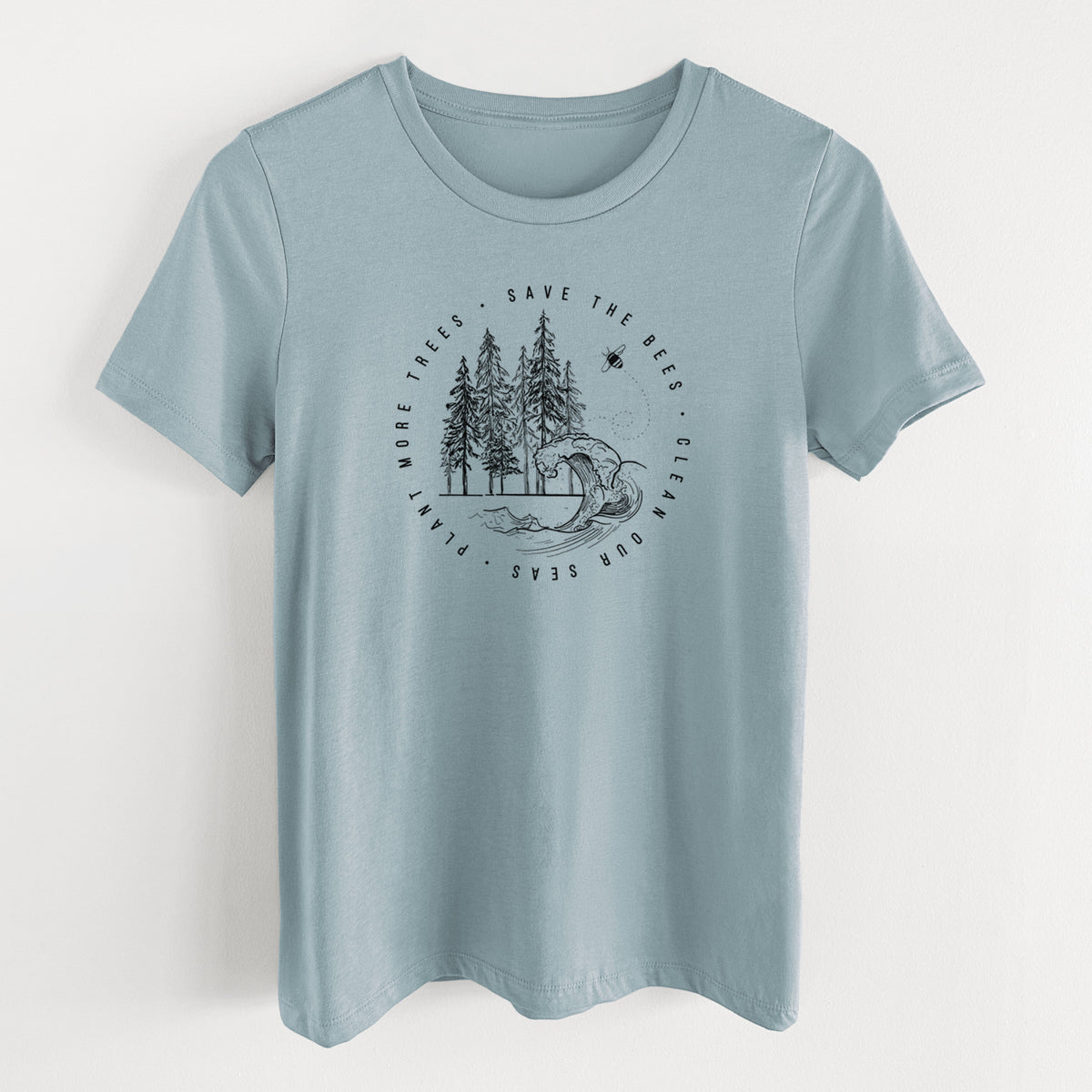 Vintage denim women's relaxed fit cotton t-shirt laid flat, printed with a circle of pine trees and an ocean wave ringed by the words Save the Bees, Clean Our Seas, Plant More Trees.
