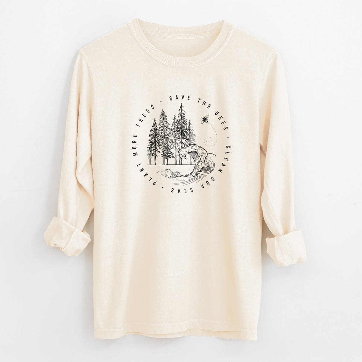 Ivory Comfort Colors long sleeve shirt laid flat with the cuffs rolled, printed with a circle of pine trees and an ocean wave ringed by the words Save the Bees, Clean Our Seas, Plant More Trees.