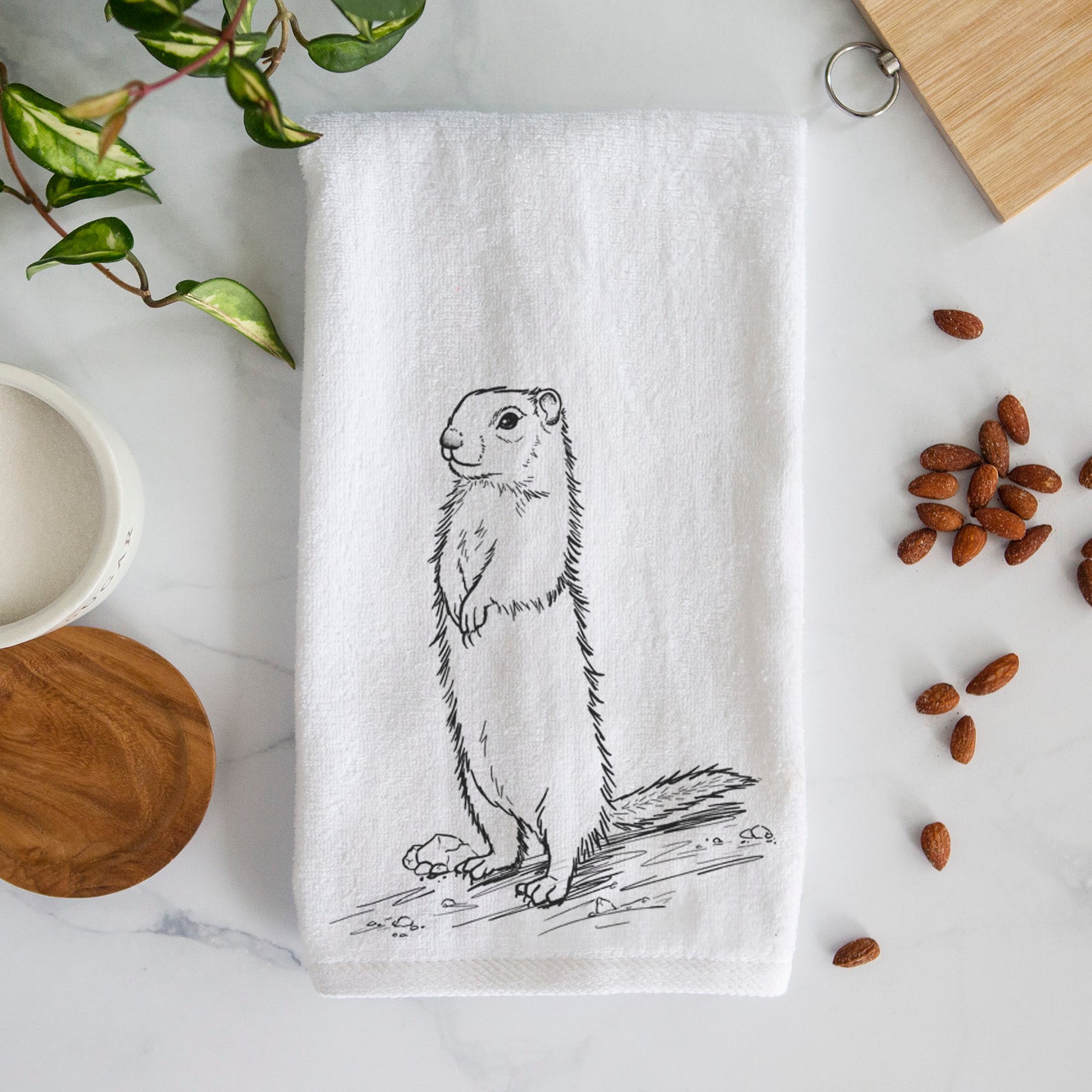 White hand towel printed with a detailed black ink illustration of a Belding's ground squirrel standing upright.