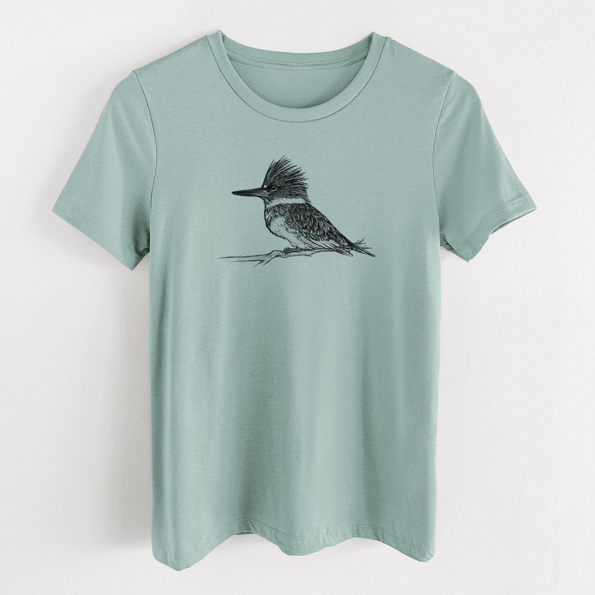 Dusty blue women's relaxed fit cotton t-shirt laid flat, printed with a detailed black ink sketch of a belted kingfisher perched on a branch.