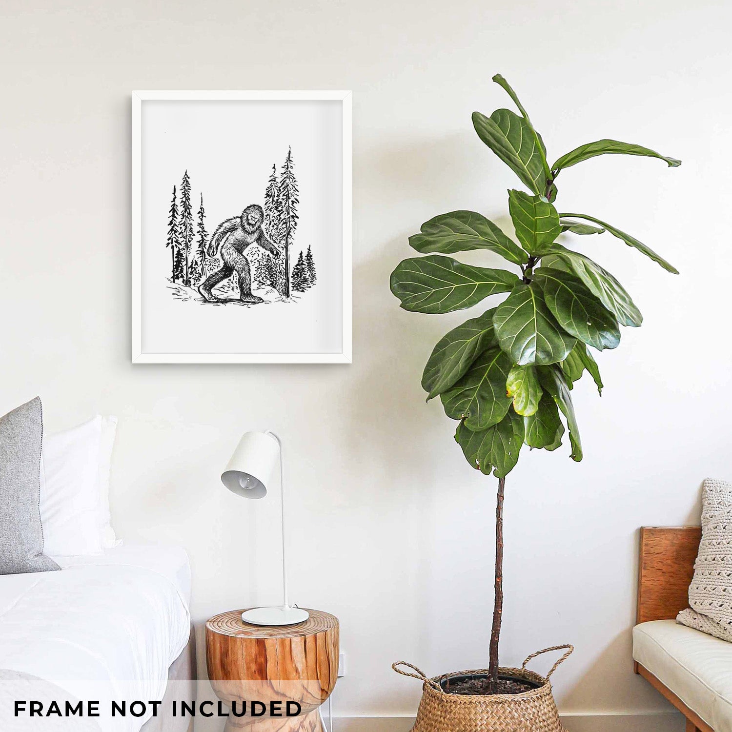 Art print of a black ink illustration of Bigfoot walking through a pine forest, shown with eucalyptus leaves.