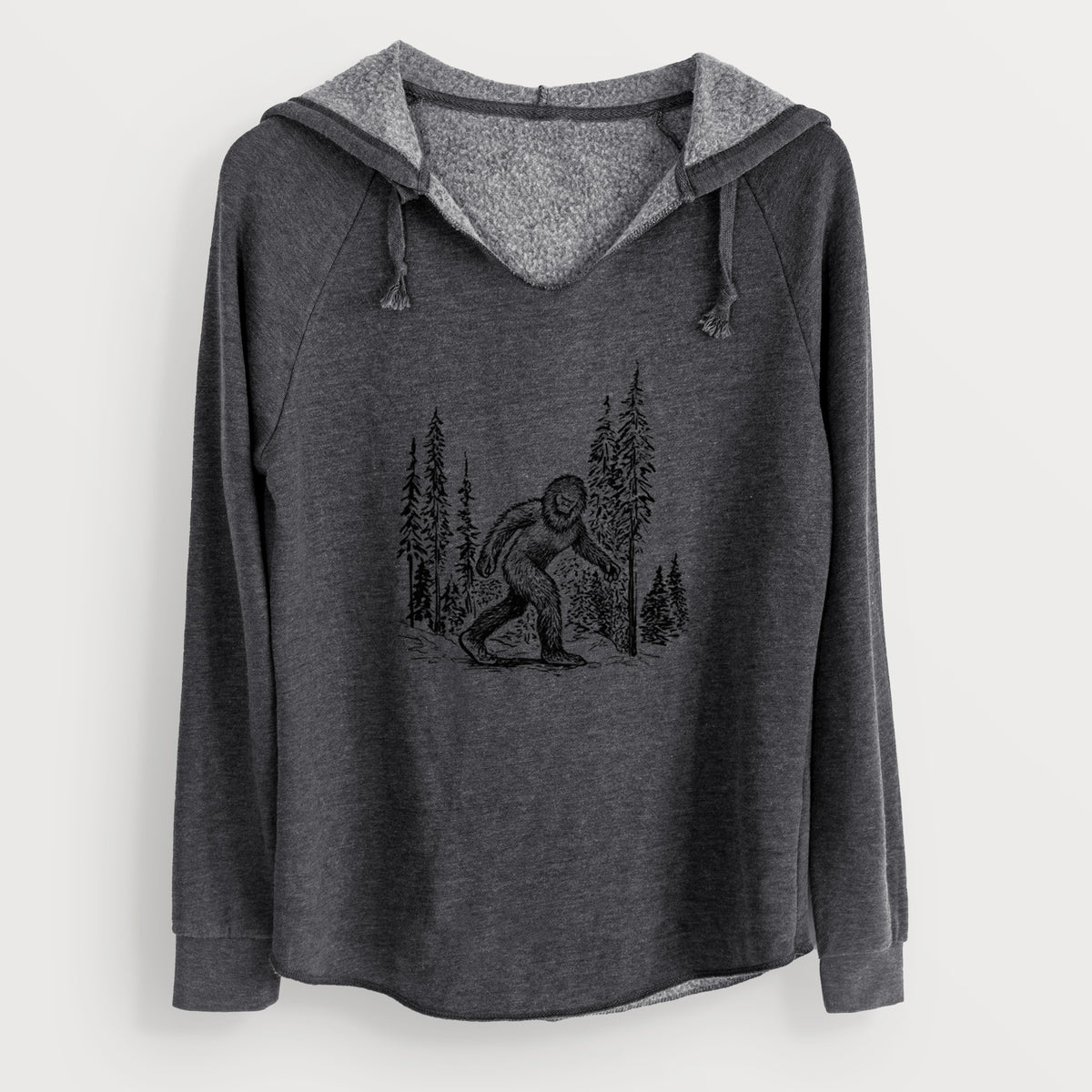 Charcoal grey women's Cali Wave hooded sweatshirt laid flat, printed with a black ink illustration of Bigfoot walking through a pine forest.