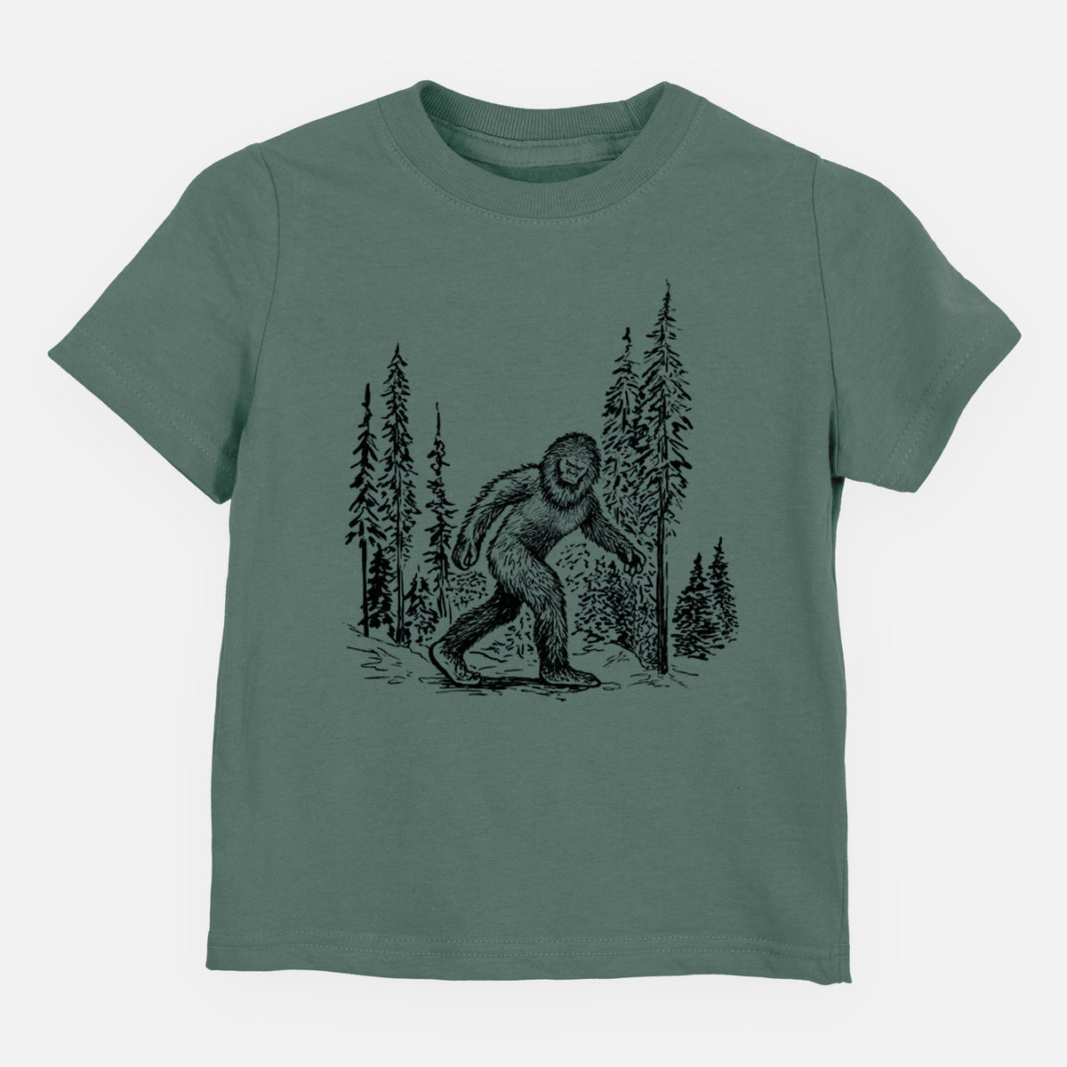 Basil green toddler t-shirt laid flat, printed with a black ink illustration of Bigfoot walking through a pine forest.