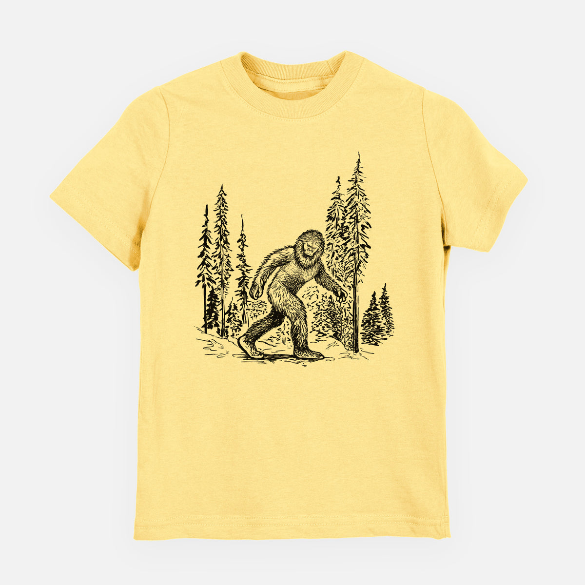Butter yellow youth t-shirt laid flat, printed with a black ink illustration of Bigfoot walking through a pine forest.