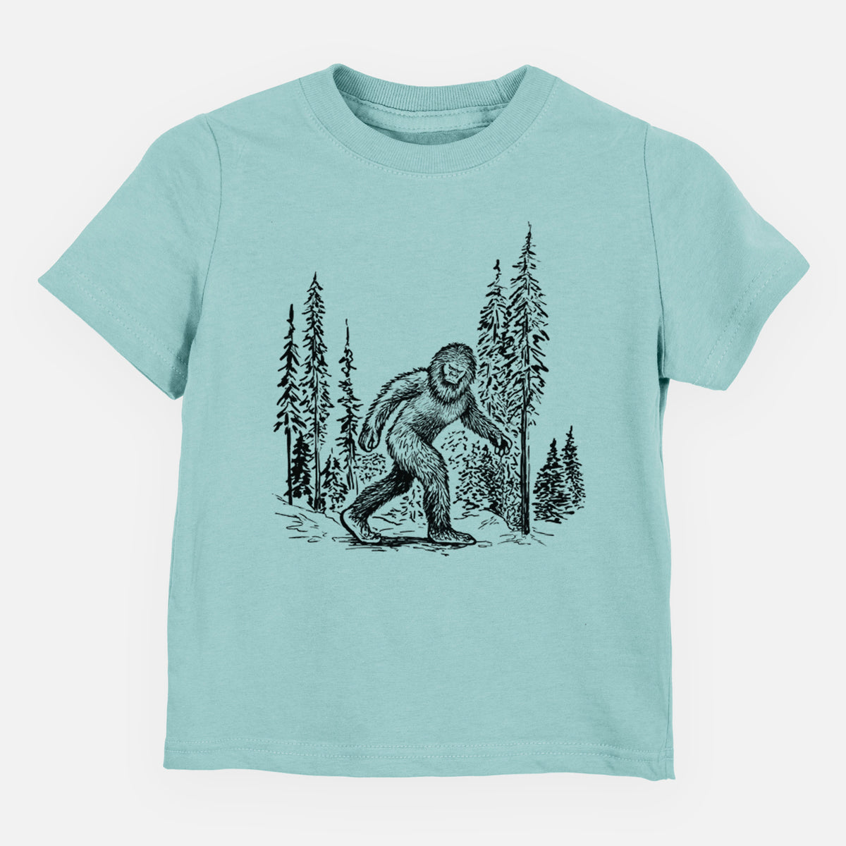 Saltwater toddler t-shirt laid flat, printed with a black ink illustration of Bigfoot walking through a pine forest.