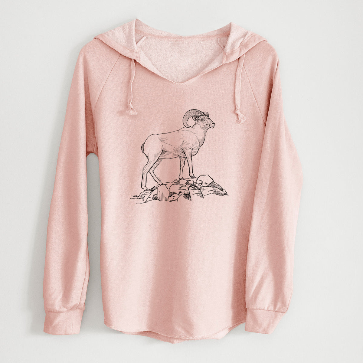 Blush pink women's Cali Wave hooded sweatshirt laid flat, printed with a black ink illustration of a bighorn ram with curled horns standing on rocks.