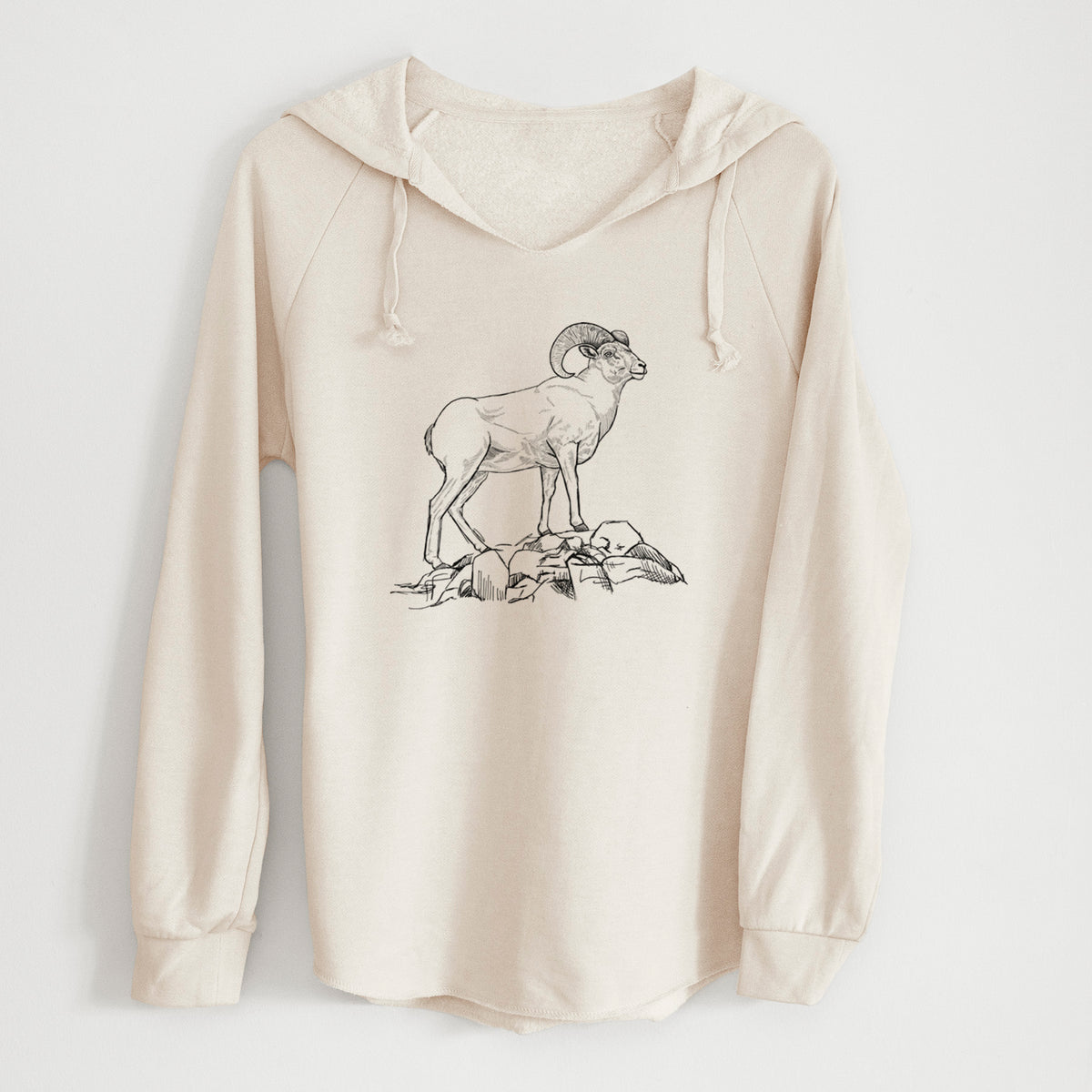 Bone cream women's Cali Wave hooded sweatshirt laid flat, printed with a black ink illustration of a bighorn ram with curled horns standing on rocks.