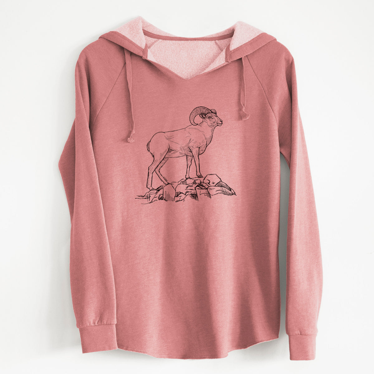 Dusty rose women's Cali Wave hooded sweatshirt laid flat, printed with a black ink illustration of a bighorn ram with curled horns standing on rocks.