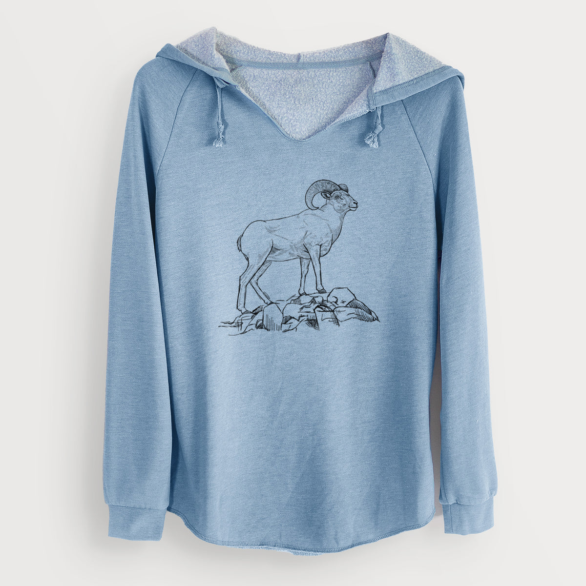 Misty blue women's Cali Wave hooded sweatshirt laid flat, printed with a black ink illustration of a bighorn ram with curled horns standing on rocks.