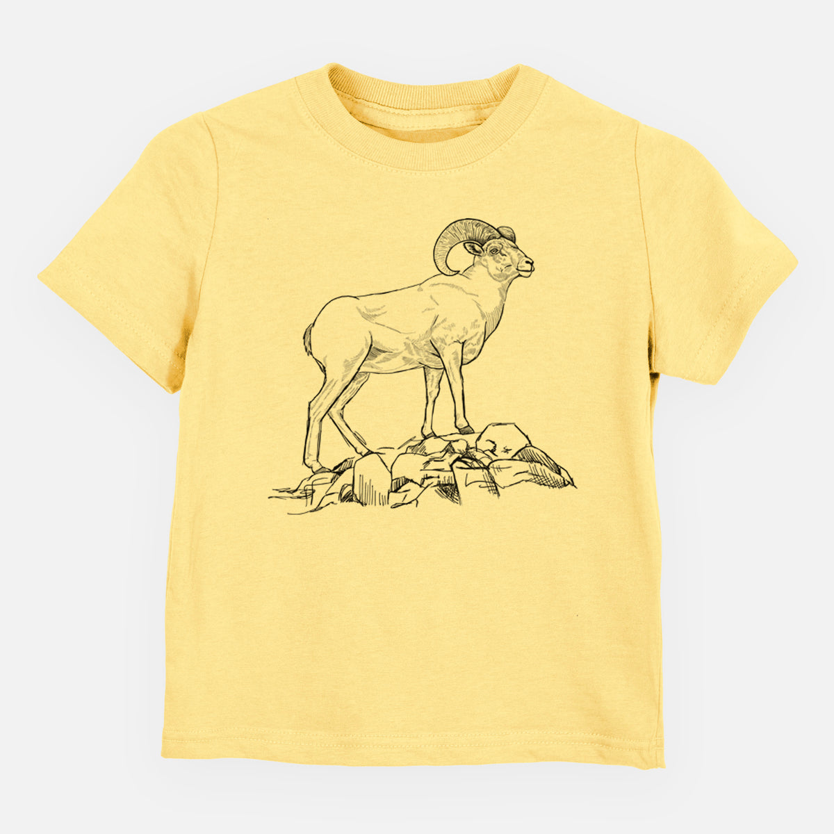 Butter yellow toddler t-shirt laid flat, printed with a black ink illustration of a bighorn ram with curled horns standing on rocks.