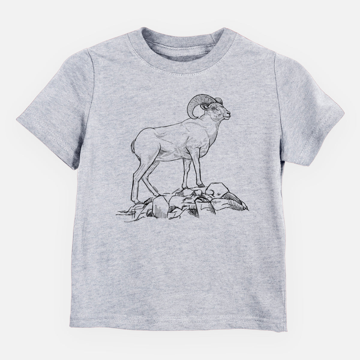 Heather grey toddler t-shirt laid flat, printed with a black ink illustration of a bighorn ram with curled horns standing on rocks.