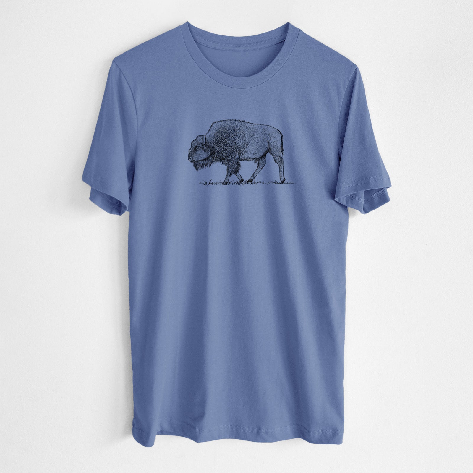 Blue bell lightweight cotton t-shirt laid flat, printed with a detailed black ink illustration of an American bison walking through grass.