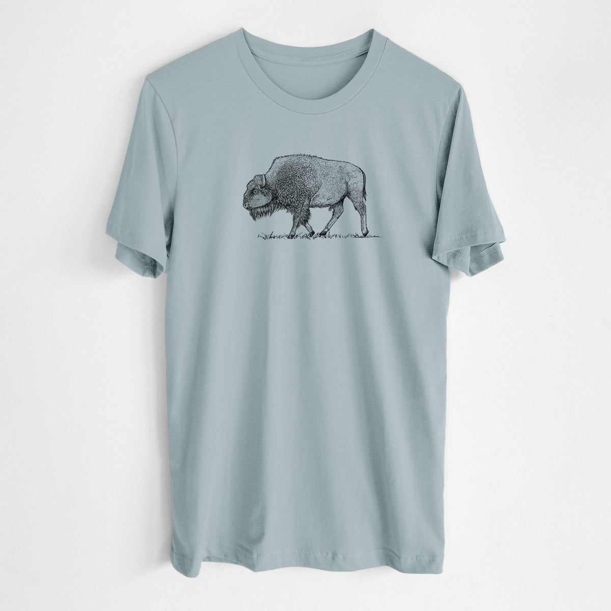 Vintage denim lightweight cotton t-shirt laid flat, printed with a detailed black ink illustration of an American bison walking through grass.