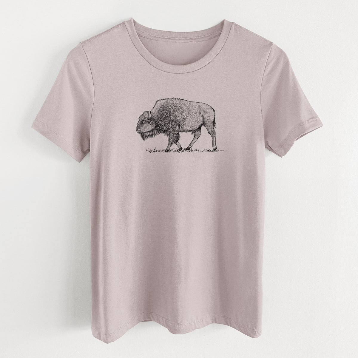 Pink gravel women's relaxed fit cotton t-shirt laid flat, printed with a detailed black ink illustration of an American bison walking through grass.