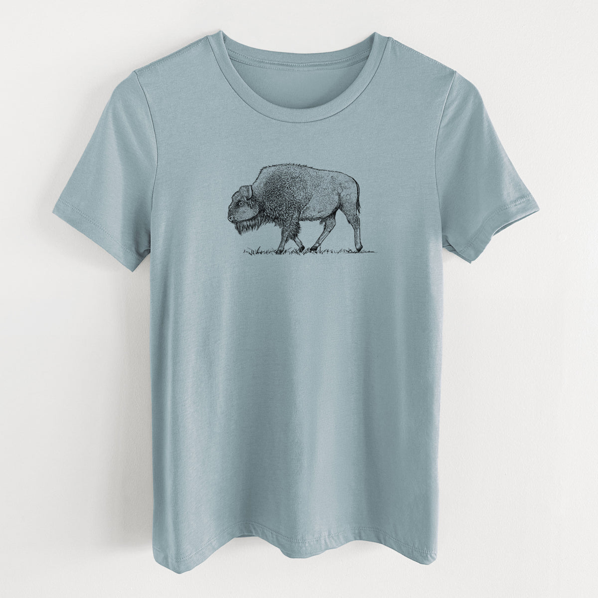 Vintage denim women's relaxed fit cotton t-shirt laid flat, printed with a detailed black ink illustration of an American bison walking through grass.