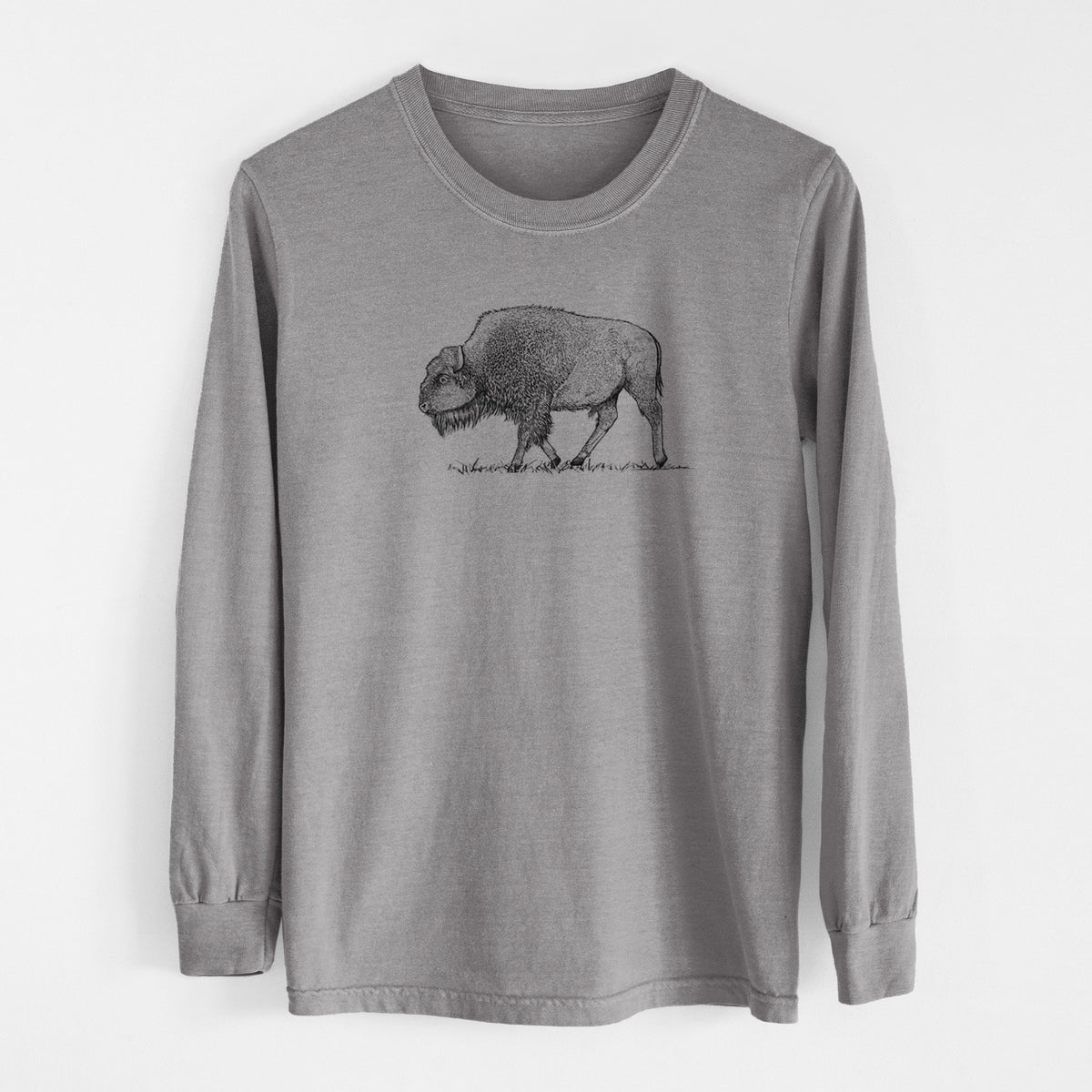 Grey Comfort Colors long sleeve shirt laid flat, printed with a detailed black ink illustration of an American bison walking through grass.