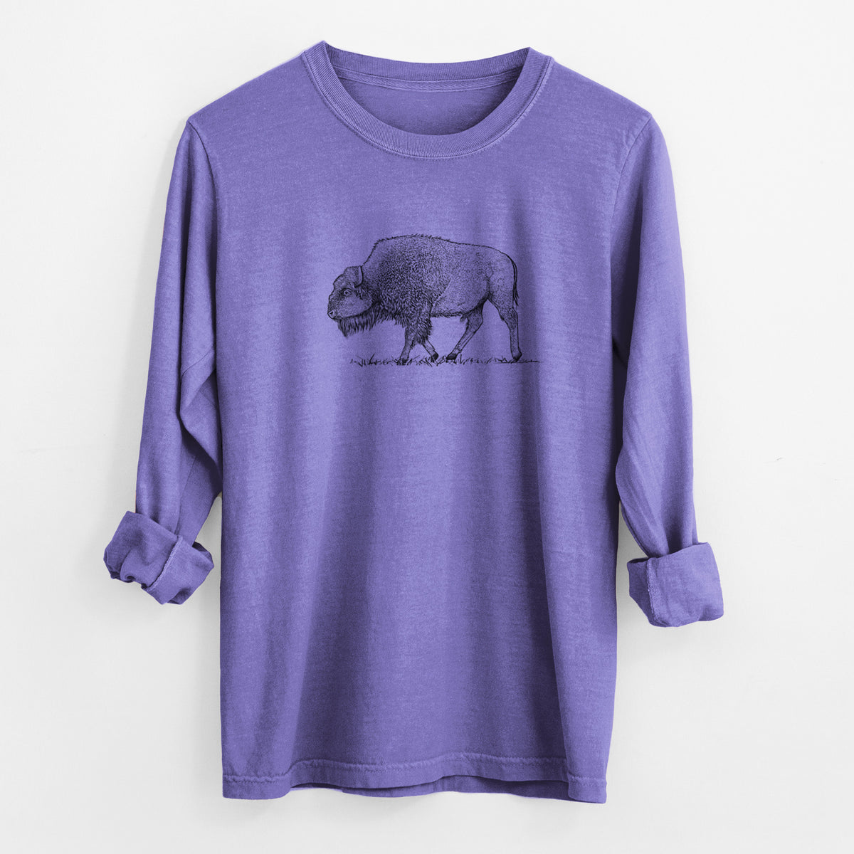 Violet purple Comfort Colors long sleeve shirt laid flat with the cuffs rolled, printed with a detailed black ink illustration of an American bison walking through grass.