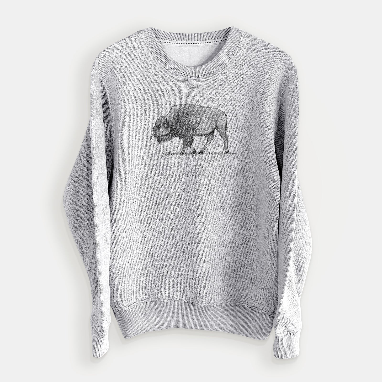 Salt and pepper knit sweatshirt laid flat, printed with a detailed black ink illustration of an American bison walking through grass.