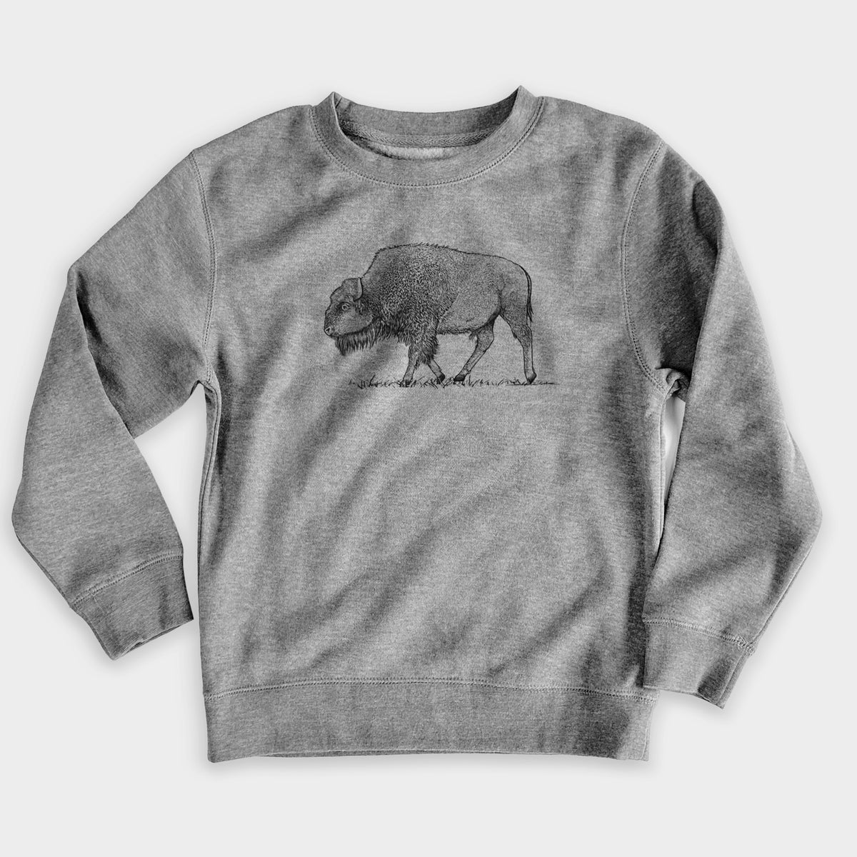 Nickel grey youth crewneck sweatshirt laid flat, printed with a detailed black ink illustration of an American bison walking through grass.