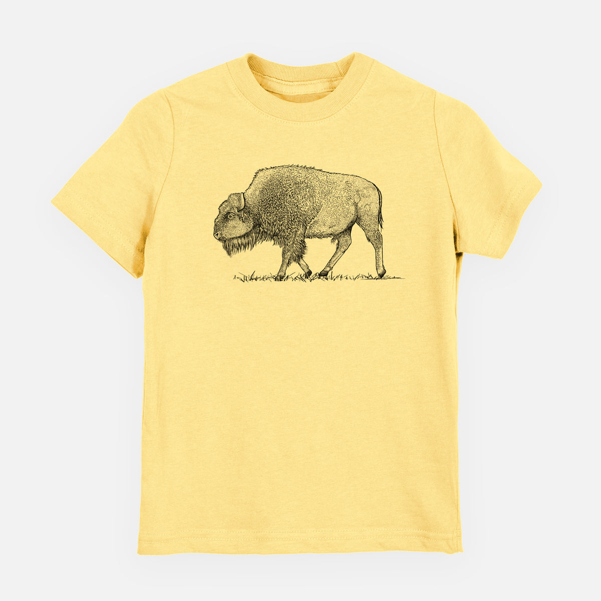Butter yellow youth t-shirt laid flat, printed with a detailed black ink illustration of an American bison walking through grass.