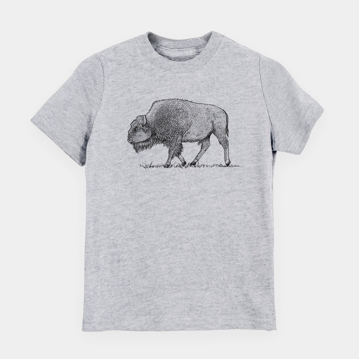 Heather grey youth t-shirt laid flat, printed with a detailed black ink illustration of an American bison walking through grass.