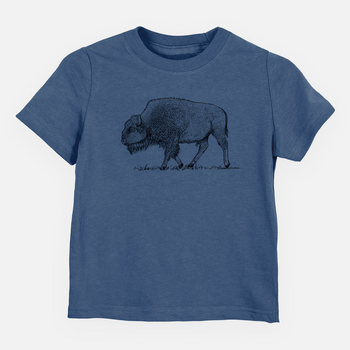 Indigo blue toddler t-shirt laid flat, printed with a detailed black ink illustration of an American bison walking through grass.