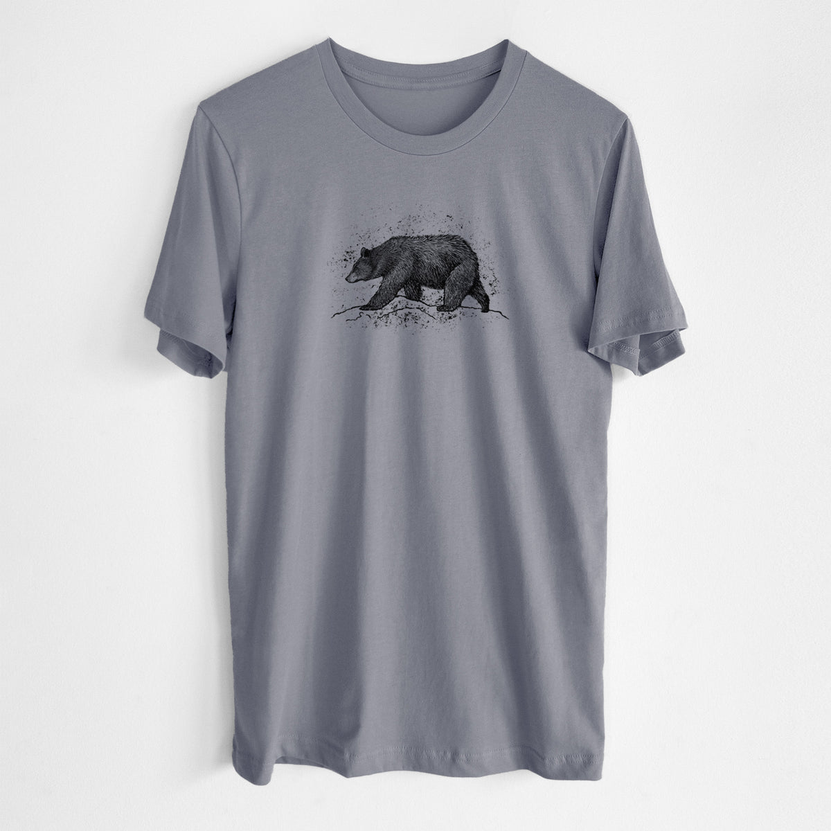 Storm grey lightweight cotton t-shirt laid flat, printed with a detailed black ink sketch of a black bear walking across rocky ground.