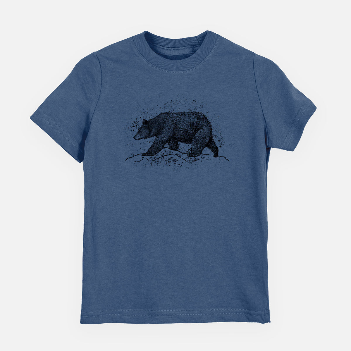 Indigo blue youth t-shirt laid flat, printed with a detailed black ink sketch of a black bear walking across rocky ground.