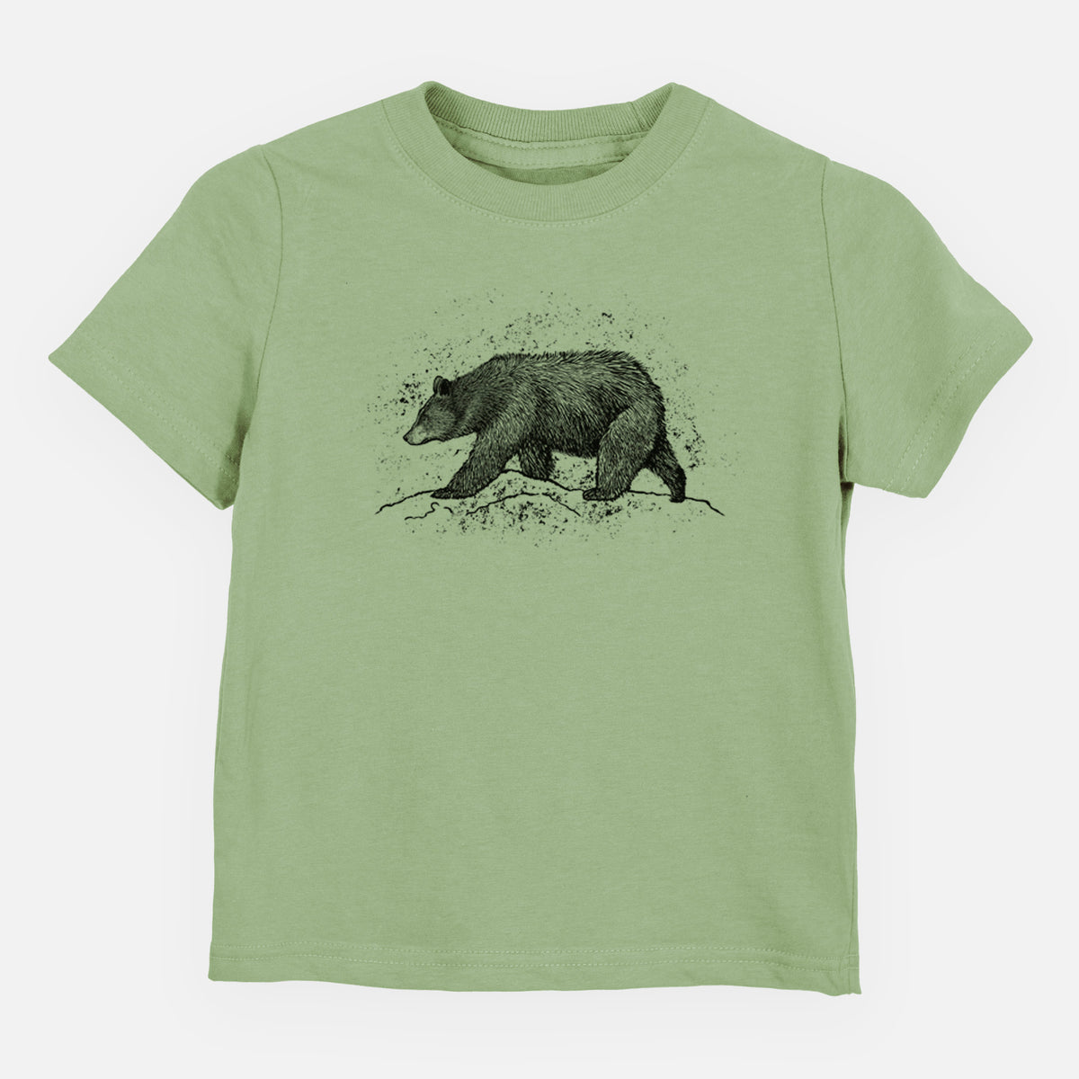 Sage green toddler t-shirt laid flat, printed with a detailed black ink sketch of a black bear walking across rocky ground.