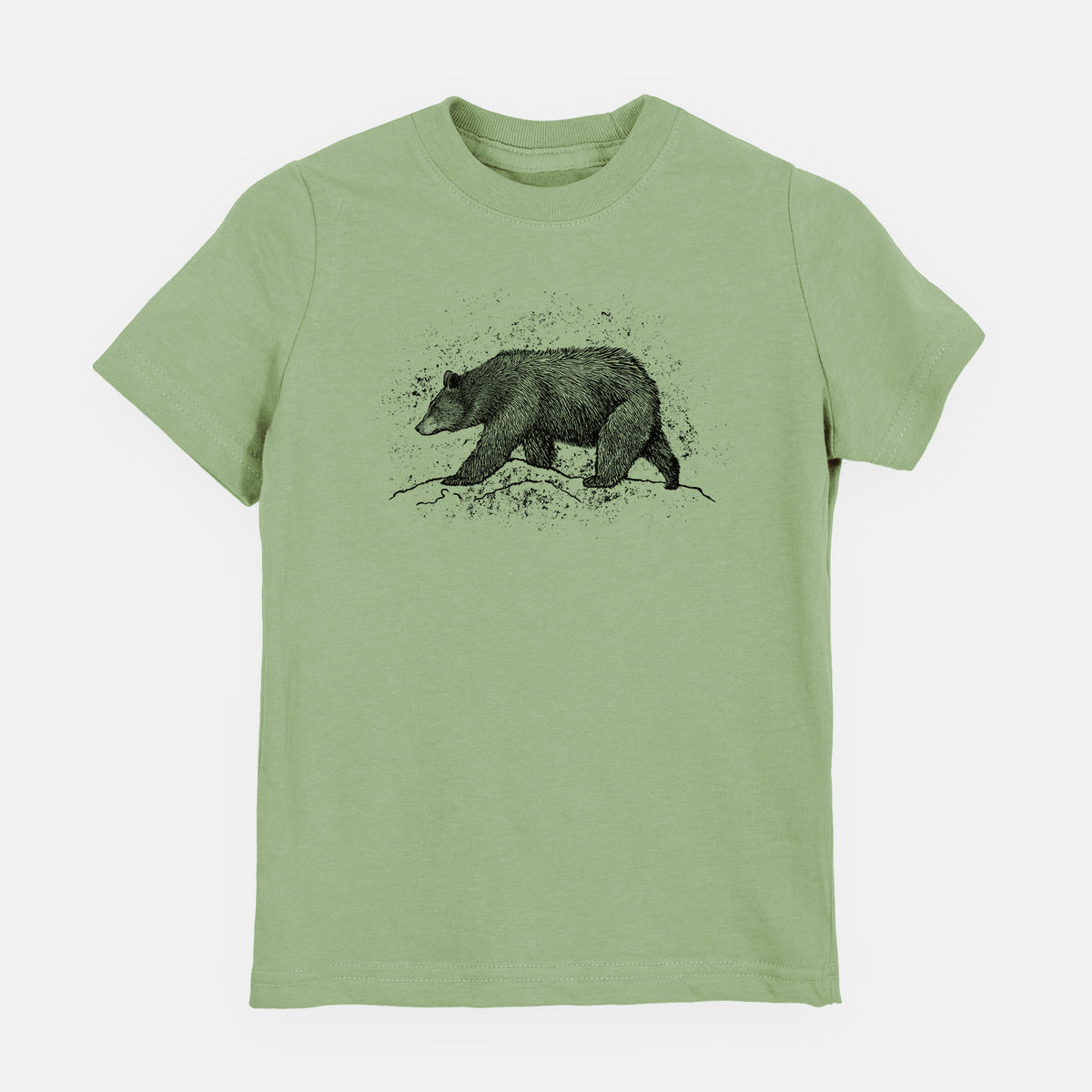 Sage green youth t-shirt laid flat, printed with a detailed black ink sketch of a black bear walking across rocky ground.