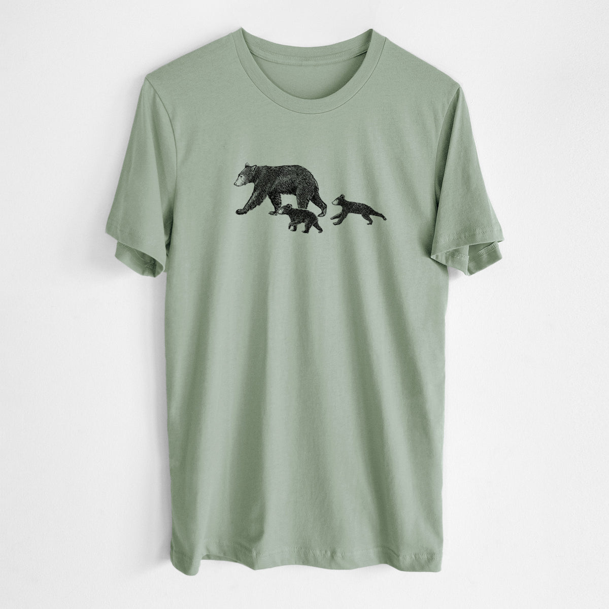 Sage green lightweight cotton t-shirt laid flat, printed with a black ink illustration of a mother black bear walking with two cubs.