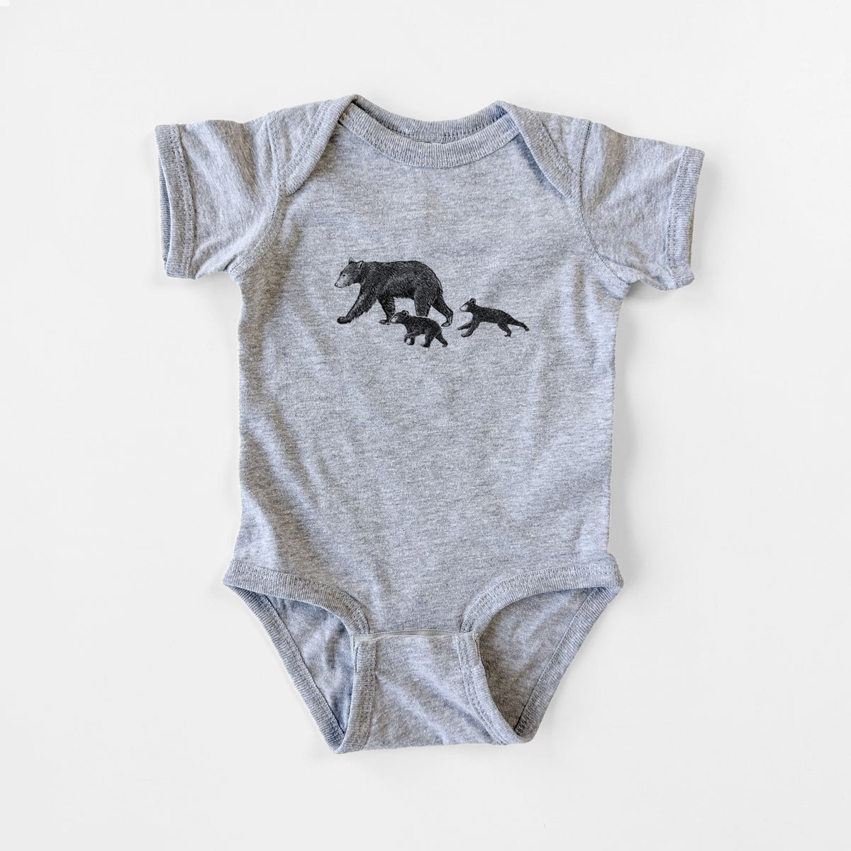 Grey baby bodysuit laid flat, printed with a black ink illustration of a mother black bear walking with two cubs.