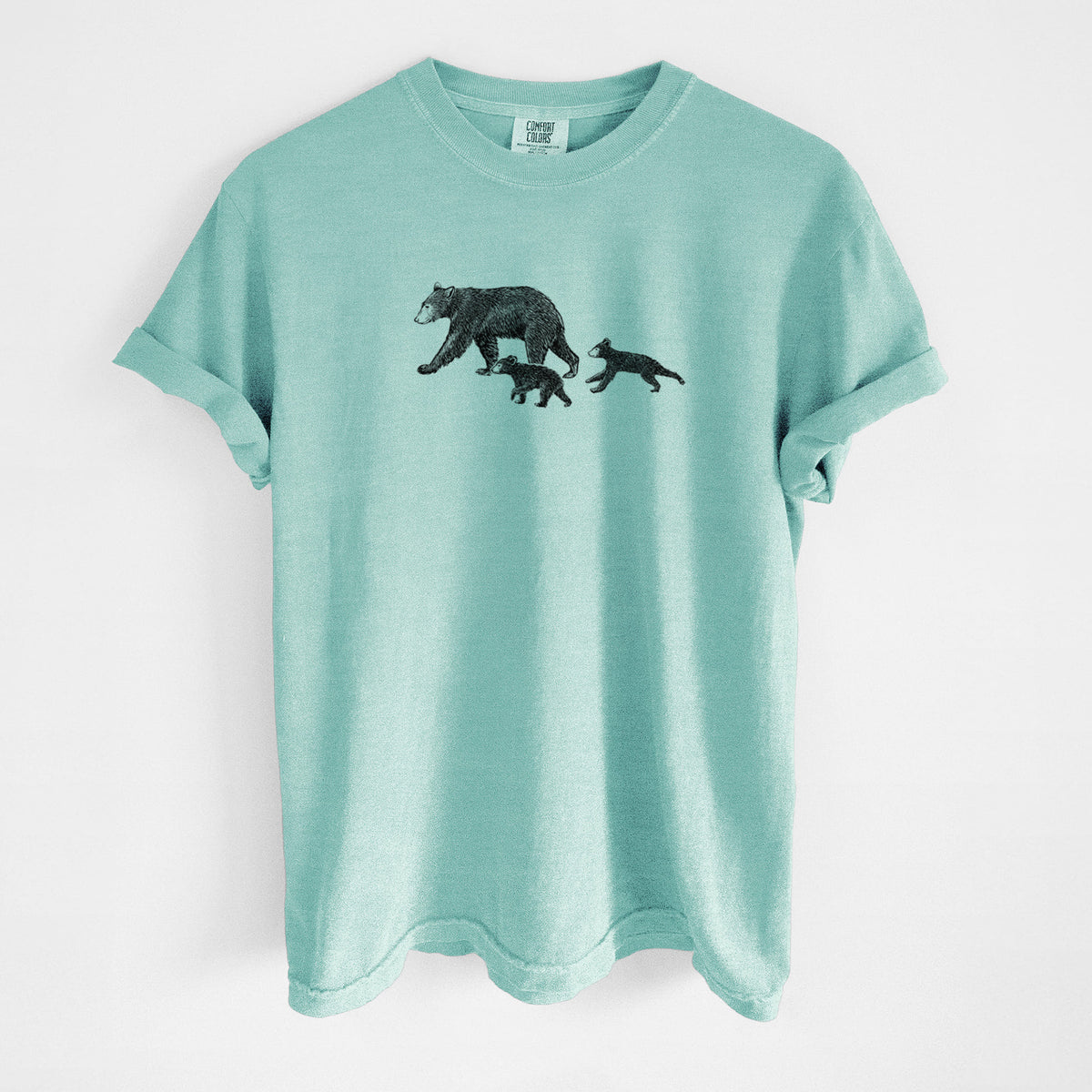 Chalky mint Comfort Colors t-shirt laid flat, printed with a black ink illustration of a mother black bear walking with two cubs.