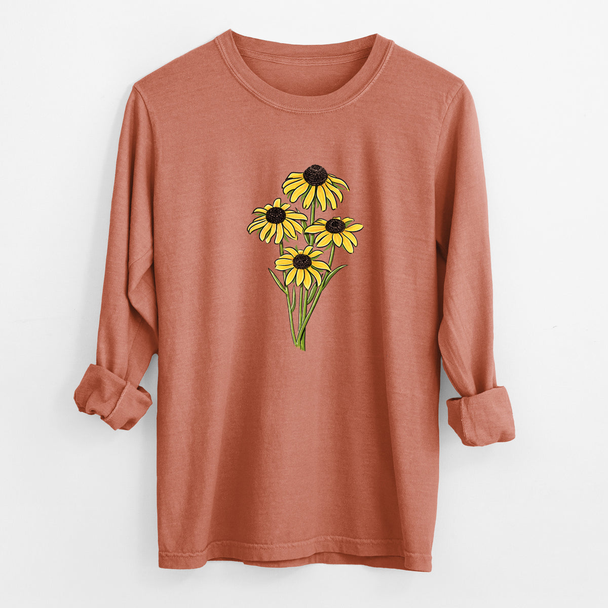 Yam burnt orange Comfort Colors long sleeve shirt laid flat with the cuffs rolled, printed with a full-color bouquet of yellow black-eyed Susan flowers.